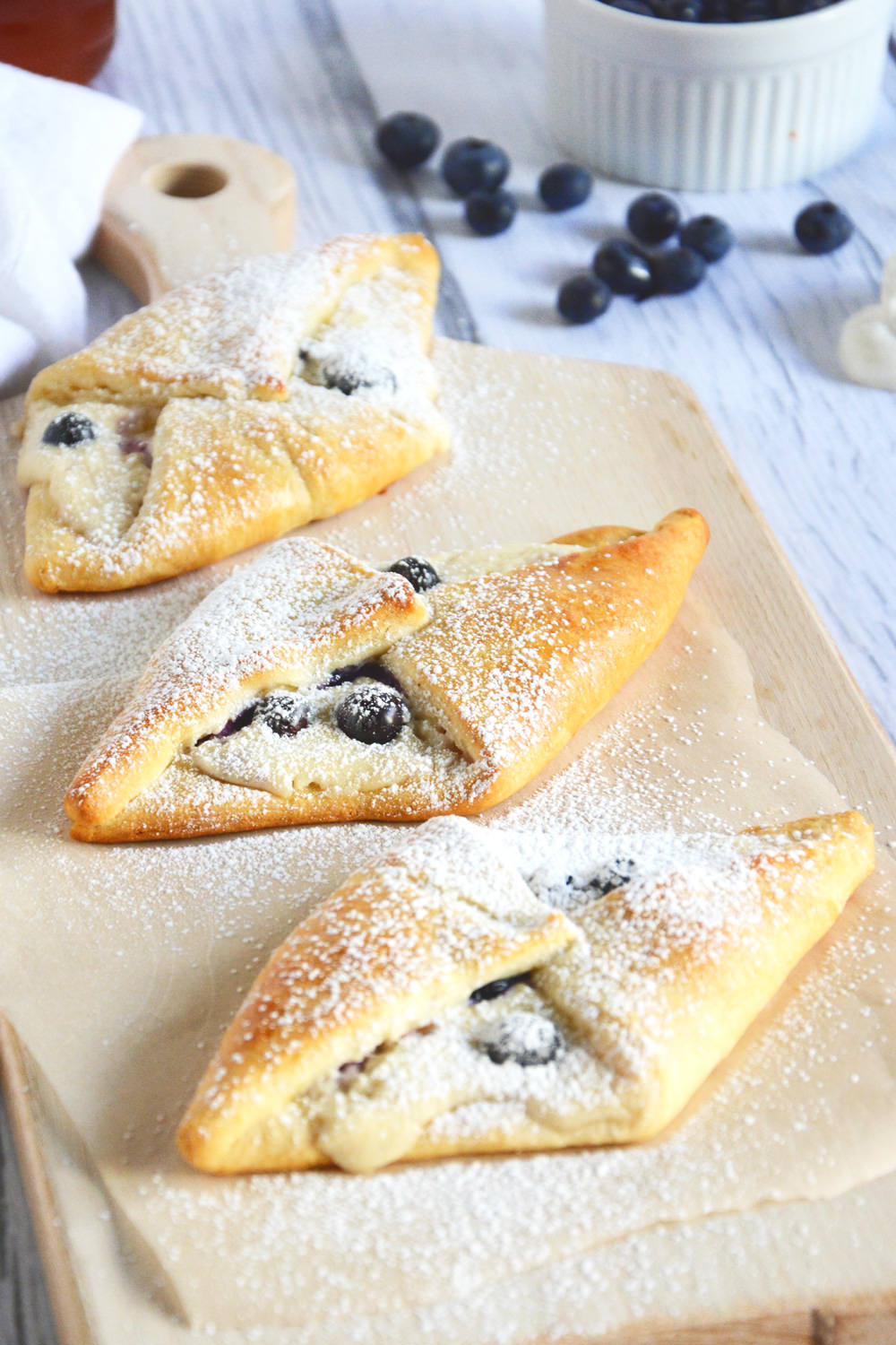 Buttery and flakey croissants filled with whipped honey cream cheese and tart blueberries are the perfect breakfast!
