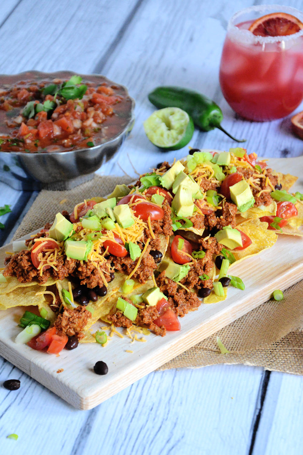 Quick and flavorful Enchilada Nachos with spiced, lean ground turkey makes these loaded nachos a crowd pleaser! 