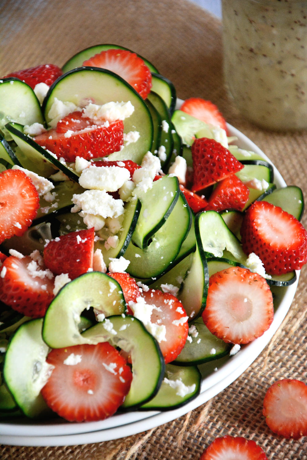 A refreshing and crisp salad with spiralized cucumbers, juicy strawberries and feta salad all topped with a fruity poppyseed dressing!