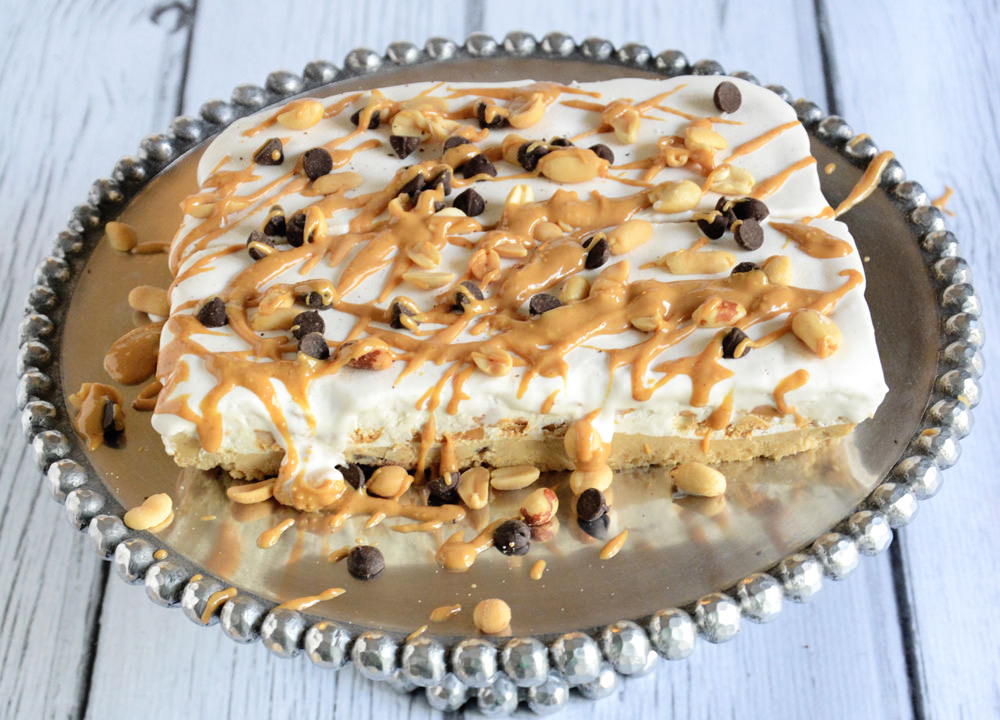 A creamy and rich peanut butter ice cream cake with a cookie dough base that will surprise everyone when they find out it is figure friendly!