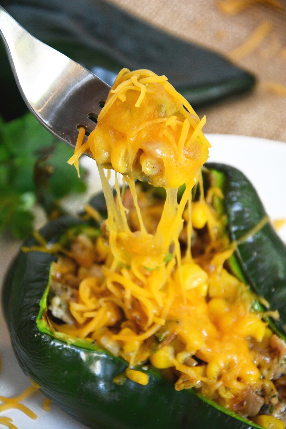 Stuffed poblano peppers loaded with flavorful chicken sausage, green chiles and fresh corn to make one nutrient dense meal!