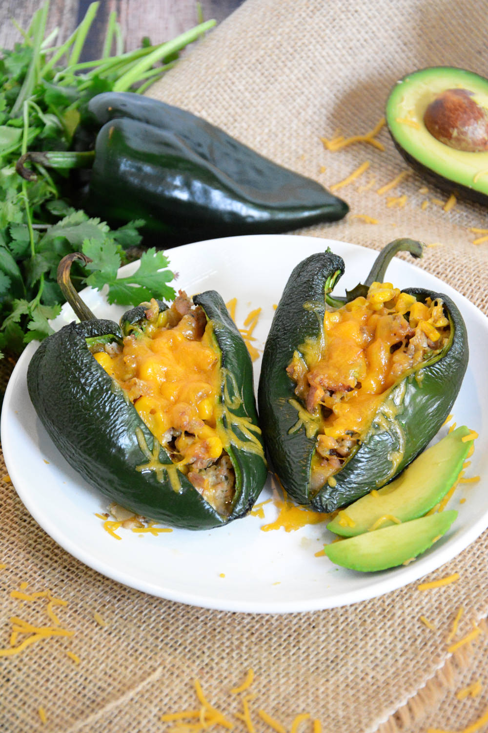 Stuffed poblano peppers loaded with flavorful chicken sausage, green chiles and fresh corn to make one nutrient dense meal!