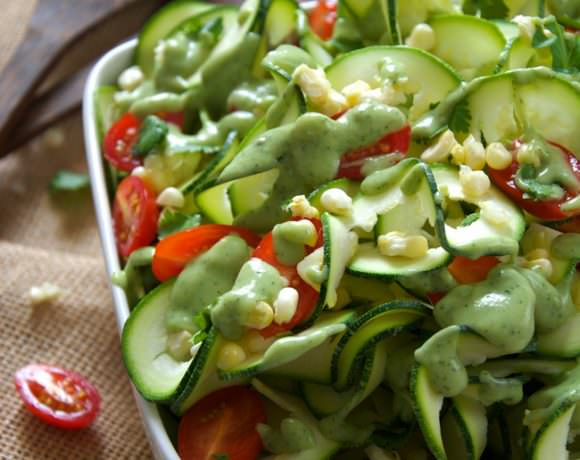 Fresh sweet corn is mixed, juicy cherry tomatoes and spiraled zucchini noodles are topped with a three ingredient dressing of creamy avocado, ranch seasoning and almond milk! A simple, raw salad that makes the most of end summer ingredients!