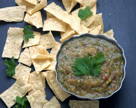 A simple salsa verde of roasted tomatillos, red onions and hatch chiles to make a sweet and smoky salsa that is perfect to any salty tortilla chip!