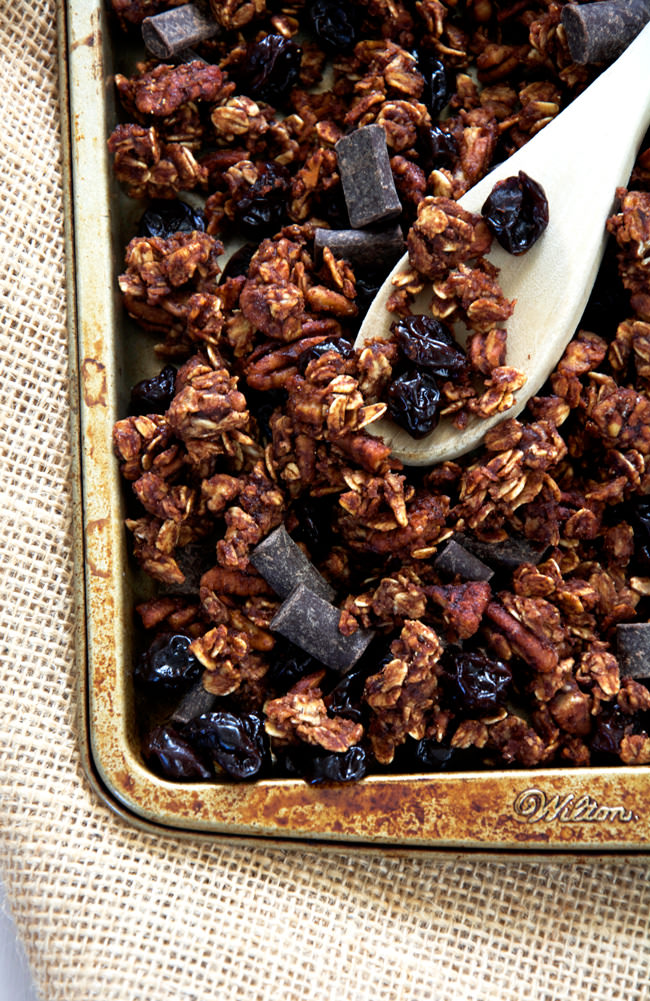 A lighter granola made with unsweetened applesauce and honey! Dark chocolate chunks, cherries and pecans make this skinny granola a decedent treat!  