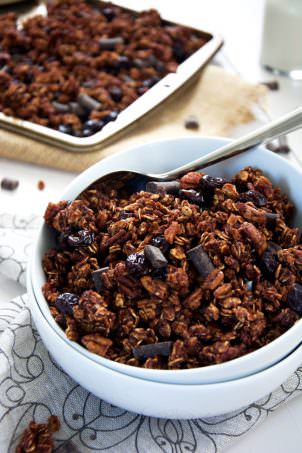A lighter granola made with unsweetened applesauce and honey! Dark chocolate chunks, cherries and pecans make this skinny granola a decedent treat!