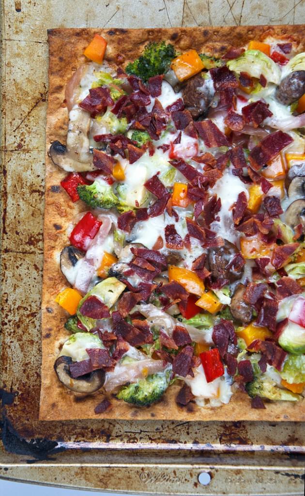 Thin and crispy lavash is used as the base for this flatbread, then topped with autumn, maple roasted veggies, crispy bacon and creamy fontina for flatbread that will please anyone! 