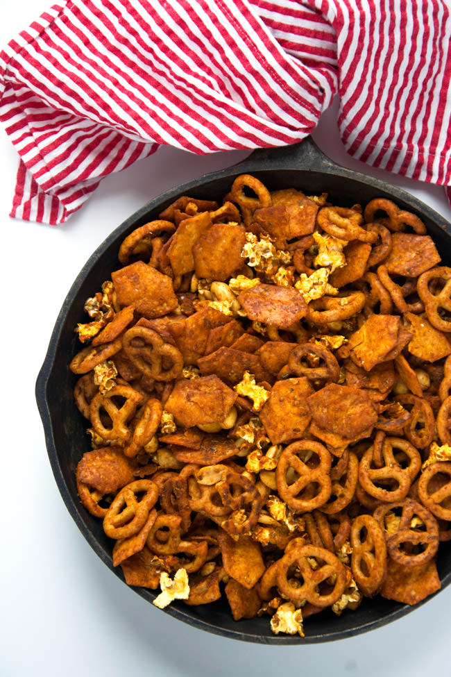 A cheesy and spicy taco snack mix with crunchy popcorn, salty pretzels, buttery peanuts and cheesy crackers! Perfect for watching an afternoon football or baseball game! #snackmix #glutenfree #taco #gameday
