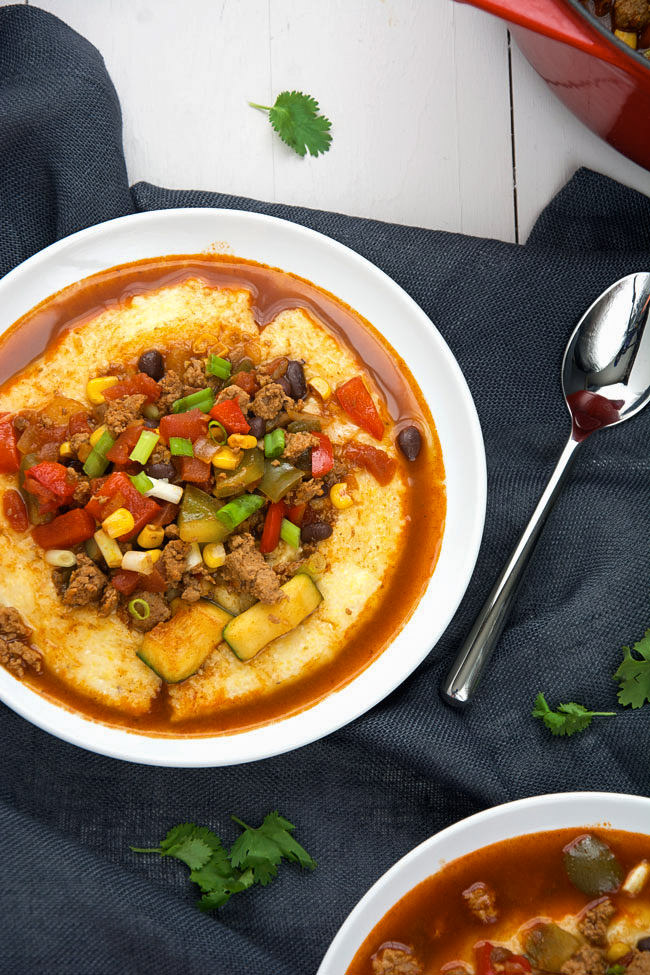 A vegetable loaded, spicy chili made with homemade turkey chorizo that sits in a bed of creamy, pepperjack polenta! #chili #chorizo #polenta #glutenfree