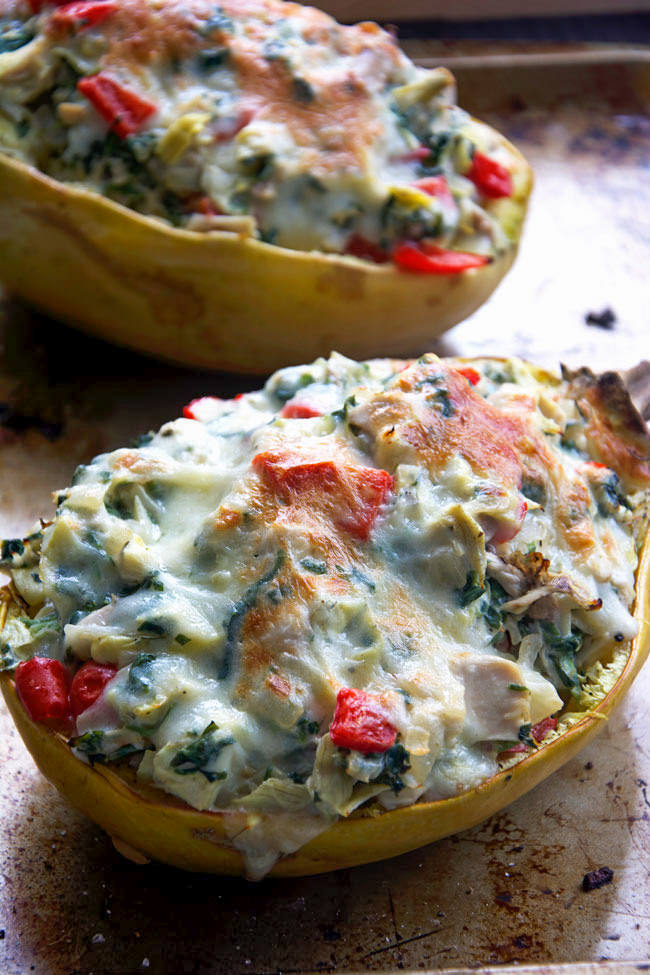 Stuffed spaghetti squash filled with a lightened up version of a favorite dip - spinach and artichoke! A super simple, yet healthy dinner that perfect any night of the week!