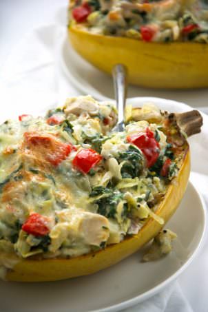 Stuffed spaghetti squash filled with a lightened up version of a favorite dip - spinach and artichoke! A super simple, yet healthy dinner that perfect any night of the week!