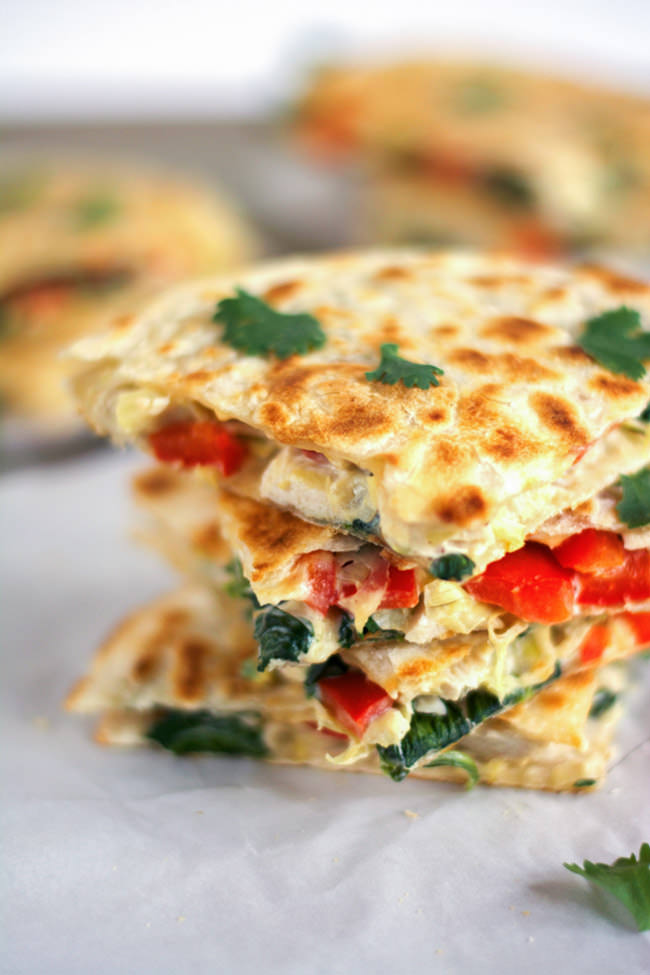 These Smoked Gouda & Turkey Artichoke Quesadillas come together quickly using leftover turkey, two types of cheese, red peppers and artichokes! They are a delicious and easy appetizer or light dinner! #healthy #leftovers #turkey #quesadilla