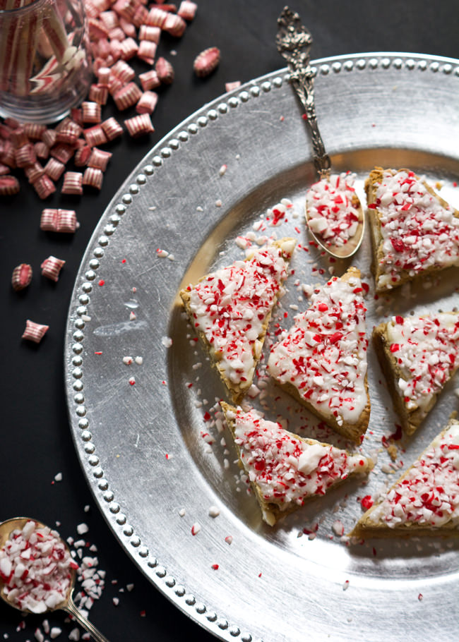 These Peppermint Crunch White Chocolate Blondies are super chewy and have the perfect sweetness! Finished off with a Greek yogurt cream cheese peppermint frosting, they are the perfect winter treat! 