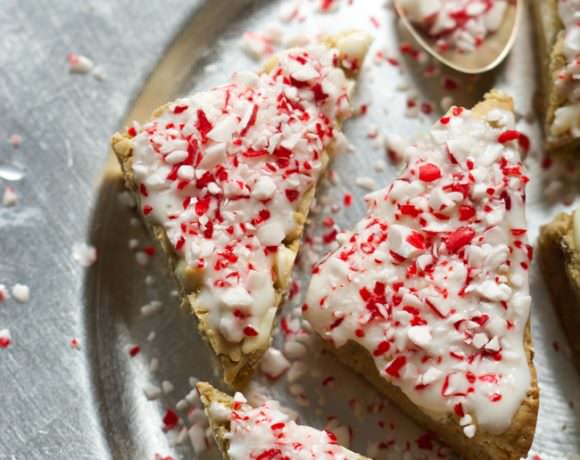 These Peppermint Crunch White Chocolate Blondies are super chewy and have the perfect sweetness! Finished off with a Greek yogurt cream cheese peppermint frosting, they are the perfect winter treat!