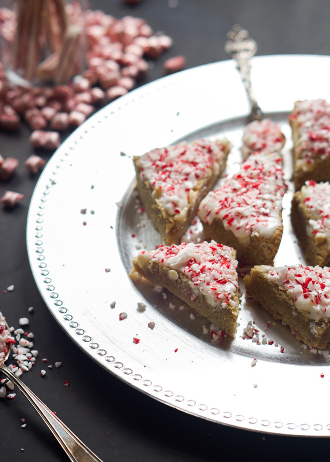 These Peppermint Crunch White Chocolate Blondies are super chewy and have the perfect sweetness! Finished off with a Greek yogurt cream cheese peppermint frosting, they are the perfect winter treat! 