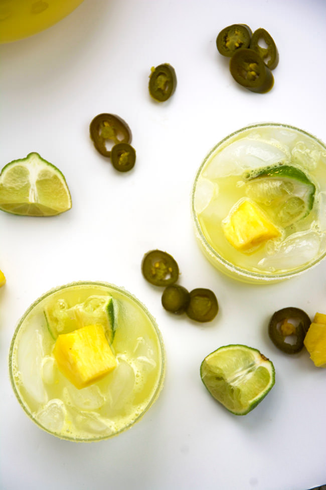 Skinny Jalapeño Pineapple Margaritas are makeover with homemade spicy simple syrup, fresh pureed pineapple and light lemonade! 