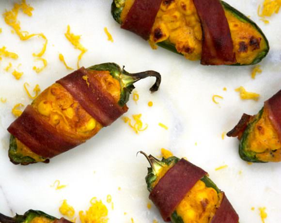 Cheesy Corn Stuffed Jalapenos will help you get out of that game day grub rut! Cheesy cornbread is stuffed into jalapenos, wrapped in turkey bacon then baked! Surprisingly healthy and completely irresistible!