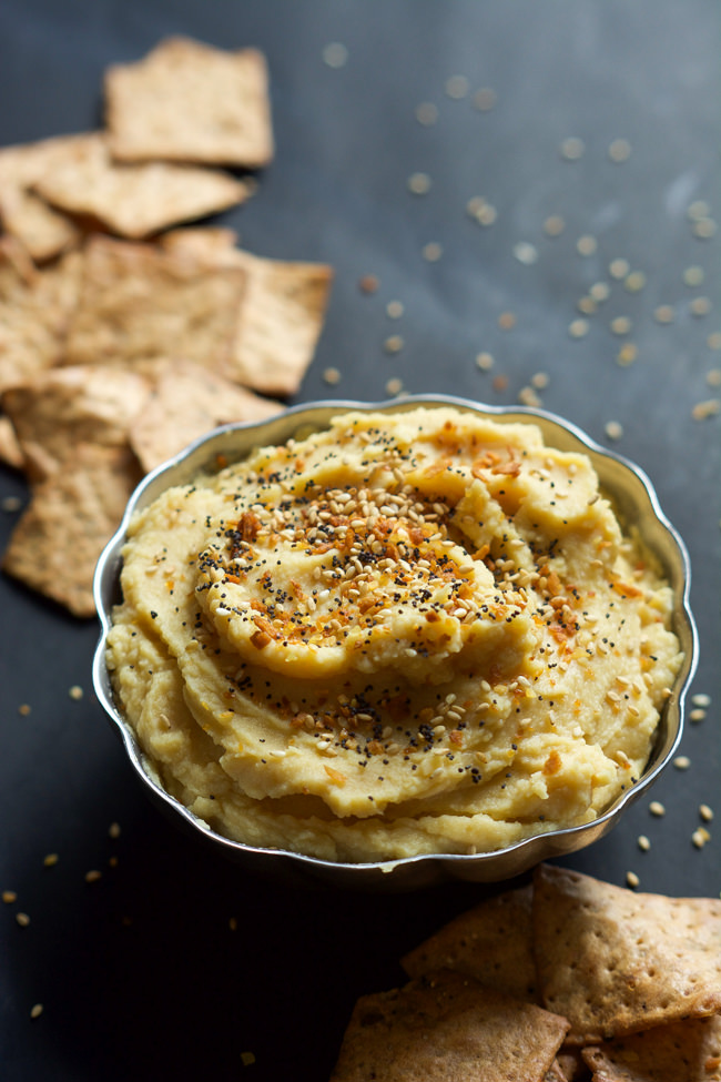 Everything Bagel Hummus has all the flavors you love of those classic bagels but in a healthy, gluten free form! Creamy chickpeas mixed with toasted garlic, dried onions then sprinkled with sesame seeds and poppy seeds!