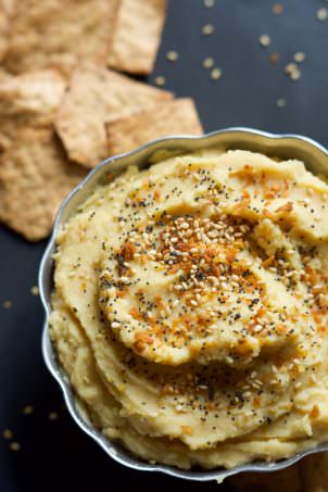 Everything Bagel Hummus has all the flavors you love of those classic bagels but in a healthy, gluten free form! Creamy chickpeas mixed with toasted garlic, dried onions then sprinkled with sesame seeds and poppy seeds!