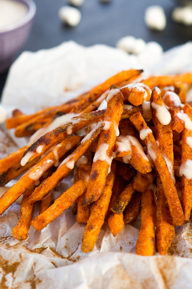 Cinnamon Sugar Sweet Potato Fries are cinnamon and sugar dusted and served with a homemade toasted marshmallow sauce! They are not your typical side of fries, rather a upgraded dessert! #sweetpotatofries #marshmallows #  #GameTimeGrub 