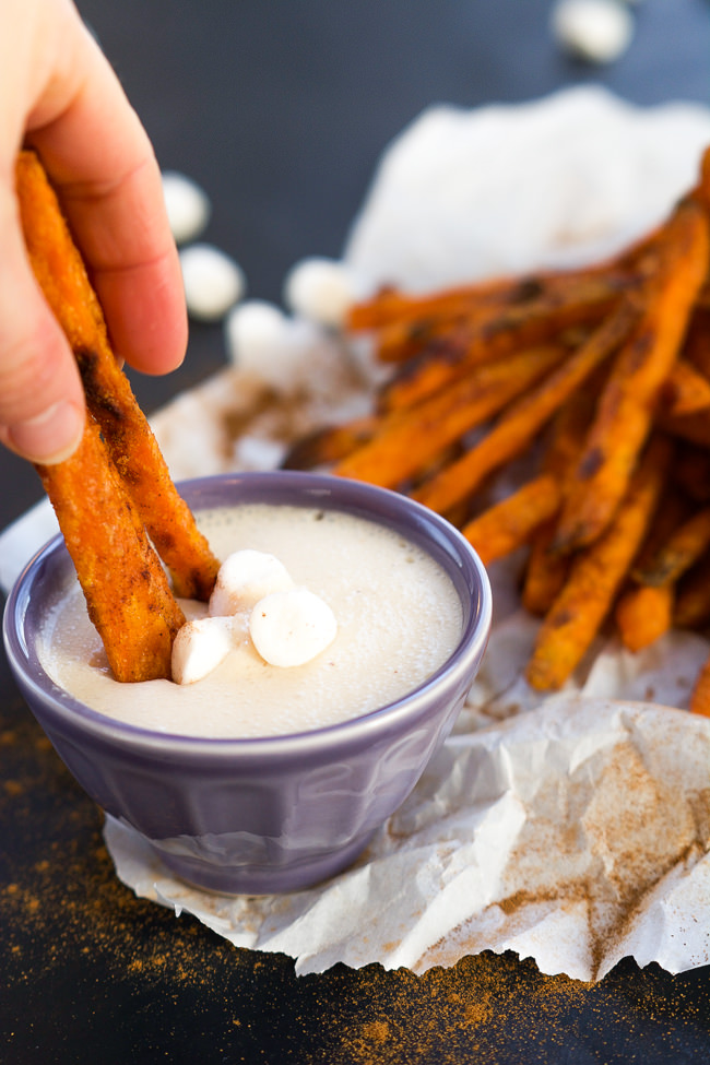 Cinnamon Sugar Sweet Potato Fries are cinnamon and sugar dusted and served with a homemade toasted marshmallow sauce! They are not your typical side of fries, rather a upgraded dessert! #sweetpotatofries #marshmallows #  #GameTimeGrub