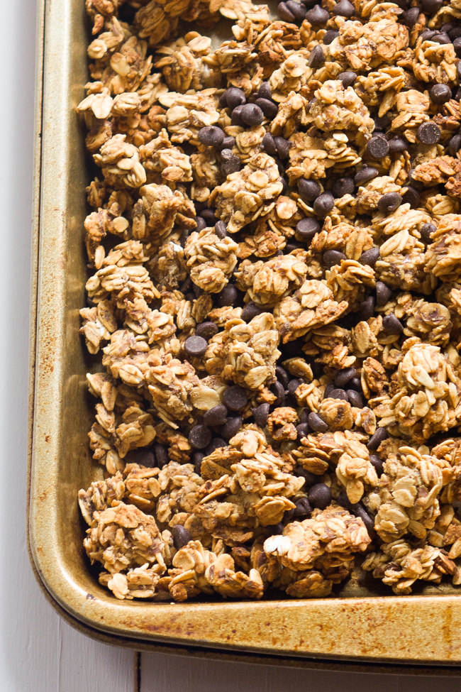 A lighter spin on granola that is filled with peanut butter and chocolate chips! This Lighter Peanut Butter Cup Granola tastes like a bite of your favorite candy!