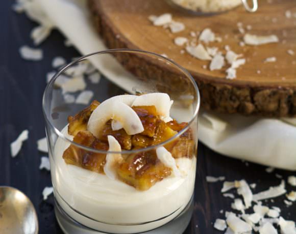 Skinny Banana Fosters Cheesecake Parfaits are madeover with cheesecake flavored greek yogurt, caramelized bananas and toasted coconut for a healthy, dessert inspired breakfast!