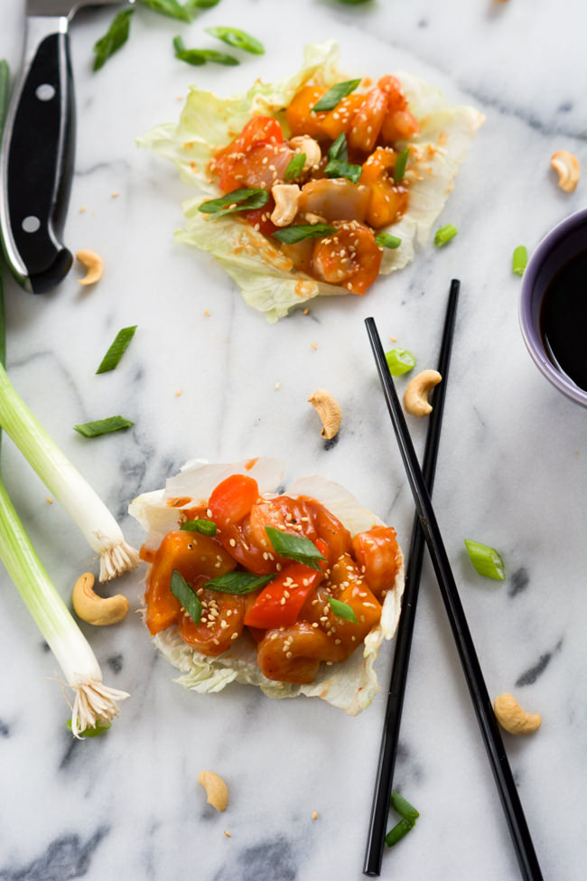 A healthy takeover make over! Skinny Sweet and Sour Shrimp Lettuce Wraps are full of Asian flavors, lighter and ready quicker than you can call take out! #Chinese #SweetandSour #LettuceWraps #glutenfree