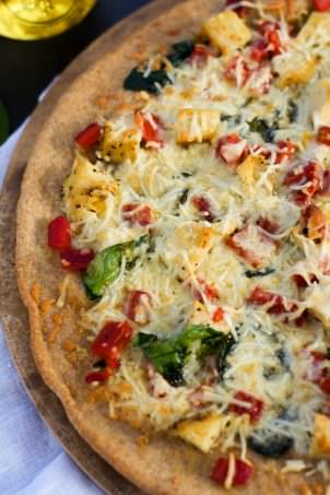 Spinach, Roasted Red Pepper and Chicken Pizza with Garlic Whole Wheat Crust is nutty, slightly sweet, savory and garlicky all in one bite! #healthy #Pizza #wholewheat #whitepizza