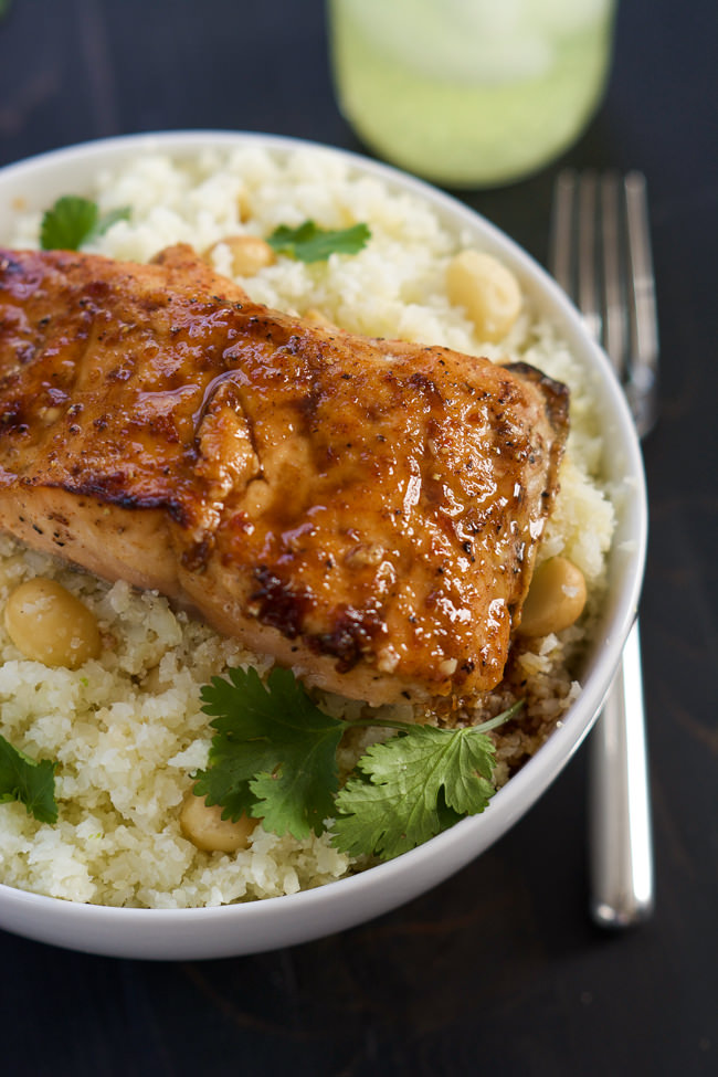 Agave Chipotle Glazed Salmon is the best of both worlds - sweet and savory! Tender salmon coated in a homemade sauce of agave, chipotle peppers, garlic and lime and served over low carb Macadamia Cauliflower Rice!