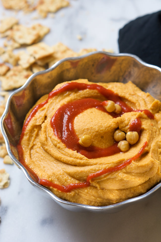 A sweet and spicy combo is the perfect pair in this Honey Sriracha Hummus that takes minutes to throw together!  