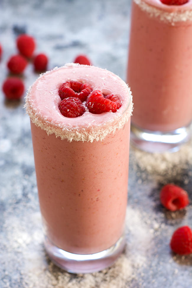 Fruity and tropical, this 4 Ingredient Raspberry Colada Smoothie is healthy, full of tart raspberries, coconut and protein for an island inspired breakfast or snack!