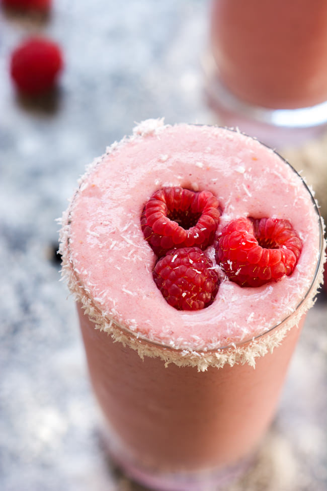 Fruity and tropical, this 4 Ingredient Raspberry Colada Smoothie is healthy, full of tart raspberries, coconut and protein for an island inspired breakfast or snack!