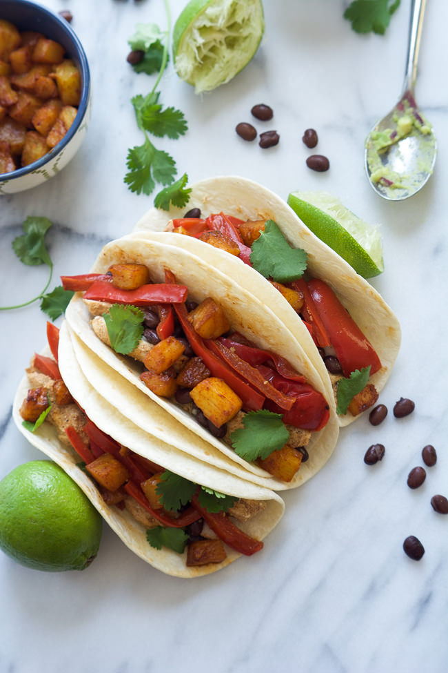 Spicy and citrus Chile Lime Chicken Tacos with Pineapple Guacamole are easy to make and topped with creamy avocado they are the perfect quick dinner!