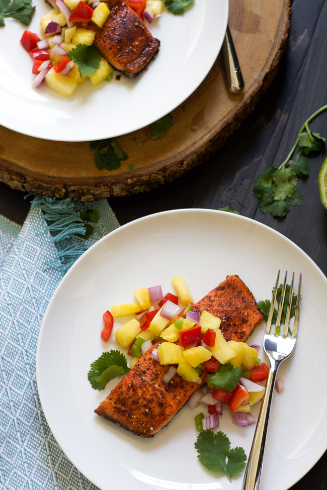 Chile spiced salmon is broiled to perfection, leaving a spicy and sweet crust on top and garnished with a fiery pineapple salsa that comes together in minutes!