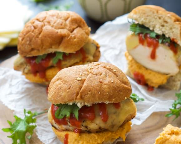 Sweet and spicy Honey Sriracha Hummus tops a juicy chicken sandwich loaded with gooey provolone for one flavorful bite!