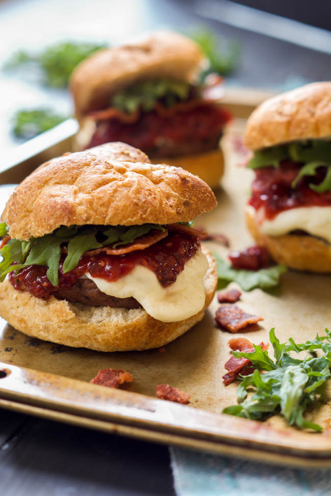 Fire up the grill for these sweet and spicy Raspberry Chipotle Mozzarella Sirloin Sliders! A homemade jelly over gooey mozzarella sirloin sliders is perfect for your next BBQ!