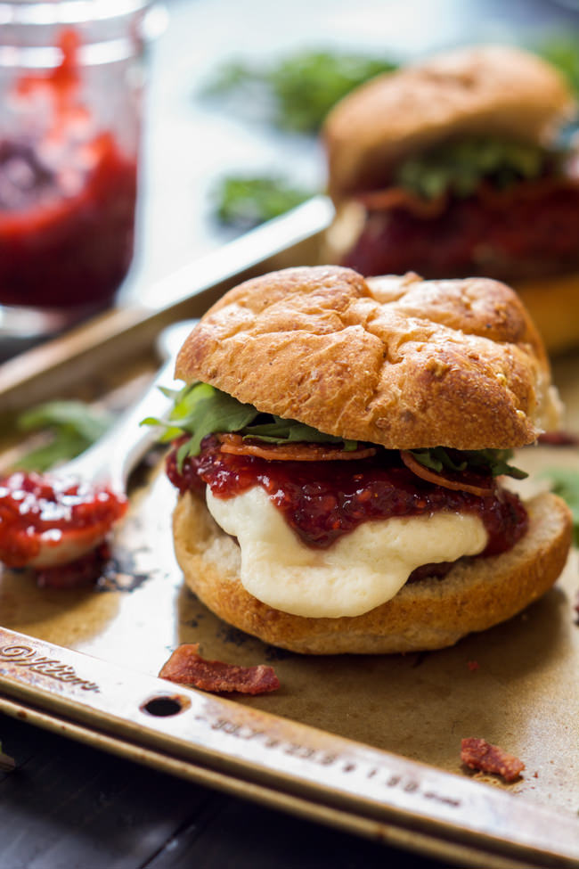 Fire up the grill for these sweet and spicy Raspberry Chipotle Mozzarella Sirloin Sliders! A homemade jelly over gooey mozzarella sirloin sliders is perfect for your next BBQ!