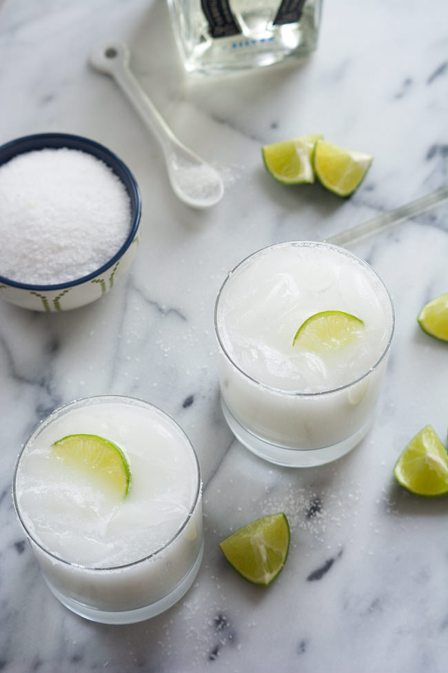 A tropical spin on the classic drink! These Skinny Coconut Margarita are made with lite coconut milk, coconut water, tequila blanco and triple sec for a refreshing cocktail! 