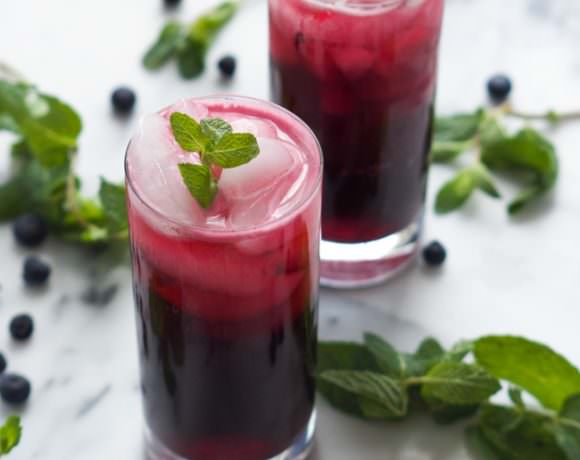 A fruity, summer staple just got made over! Skinny Sparkling Blueberry Mojito is fruity, minty and super refreshing when made with a homemade blueberry simple syrup and topped with sparkling water!