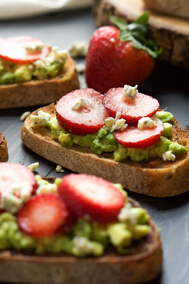 A simple, no fess appetizer that is sweet, savory and salty! Strawberry Avocado Toast with blue cheese crumbles is healthy and indulgent all in one bite and takes minutes to make!