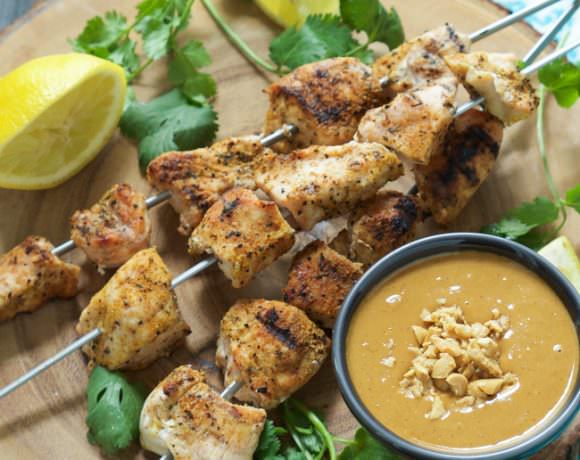 Garlic infused chicken skewers are chargrilled then drizzled with a homemade szechuan peanut sauce that will quickly become a family favorite!