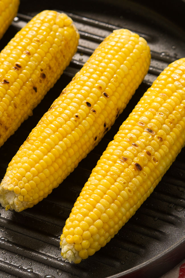 Grilled Garlic Parmesan Corn on the Cob is an easy, cheesy dish that will become a summer essential!