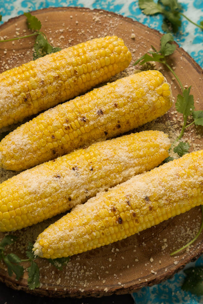 Grilled Garlic Parmesan Corn on the Cob is an easy, cheesy dish that will become a summer essential!