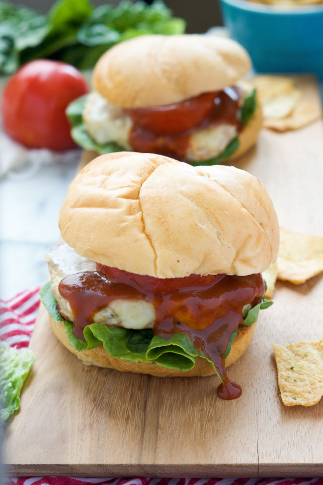 These Spicy BBQ Tex Mex Chicken Burgers are grilled to perfection and topped with spicy pepperjack cheese, juicy tomato and finished with a tangy BBQ ketchup.