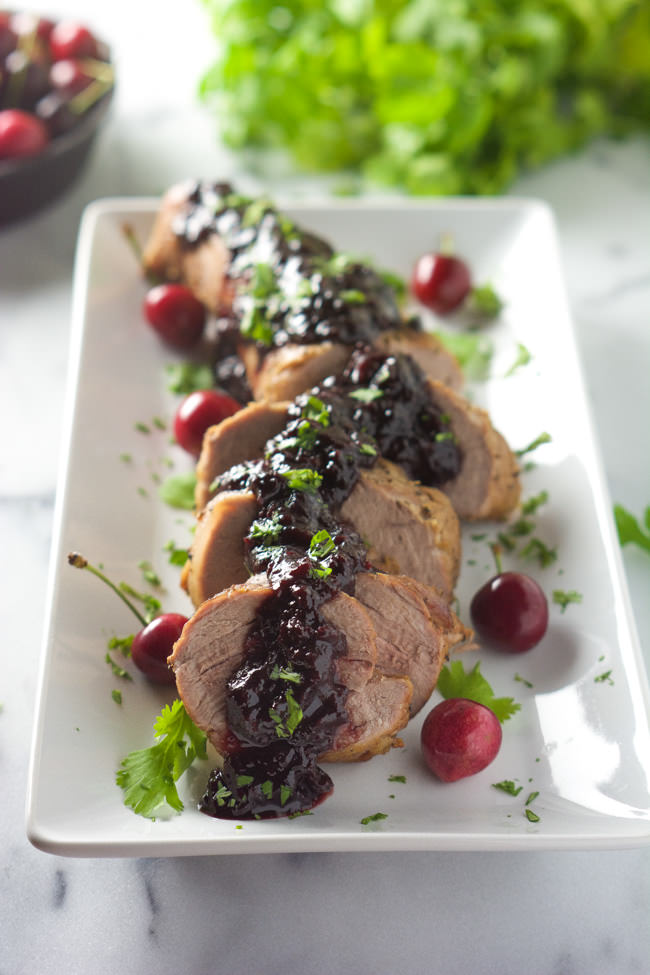 Cherry Chipotle Glazed Pork Tenderloin is a simple 5 ingredient dinner! Tender pork glazed with a chipotle spiked cherry maple sauce!