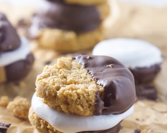 Combining two of my favorite things in these Chocolate Dipped Peanut Butter SMores! Peanut butter cookies sandwiched with marshmallow fluff and dipped in gooey chocolate!