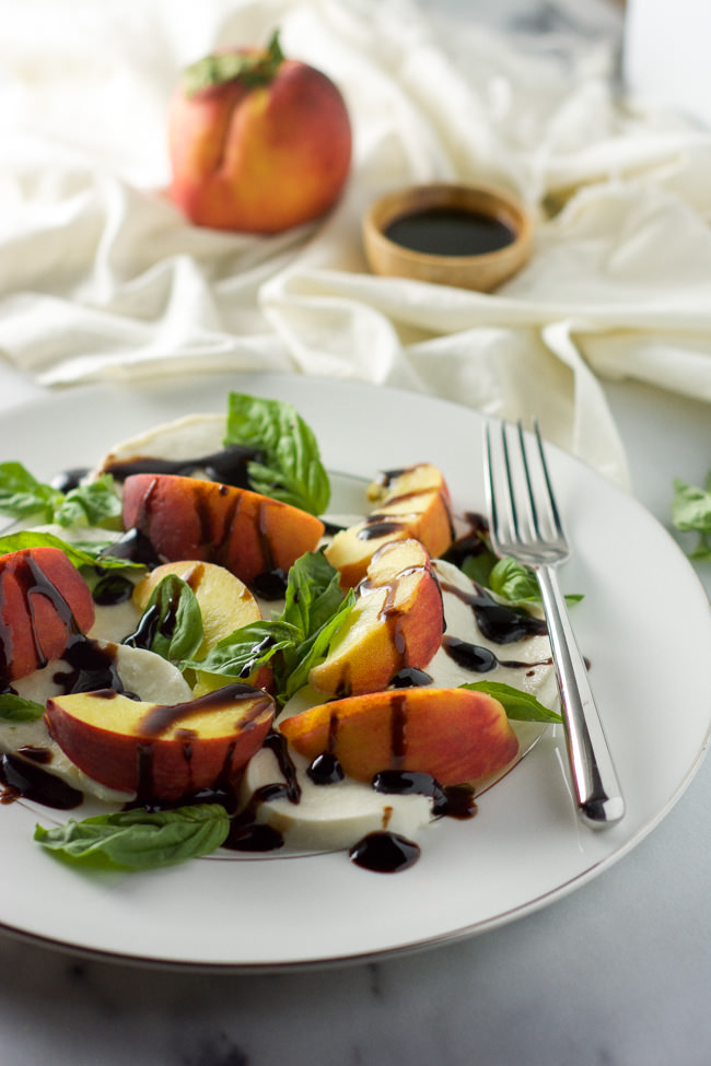 Summer Peach Caprese Salad use tasty summer peaches, creamy mozzarella, fresh basil and finished with a balsamic glaze for a simple no cook dinner!