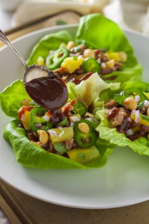All the flavors of our favorite pizza but in a slimmed down dish! Spicy Pineapple BBQ Pork Lettuce Wraps are sweet, spicy and a quick dinner that is perfect for entertaining or any weeknight!