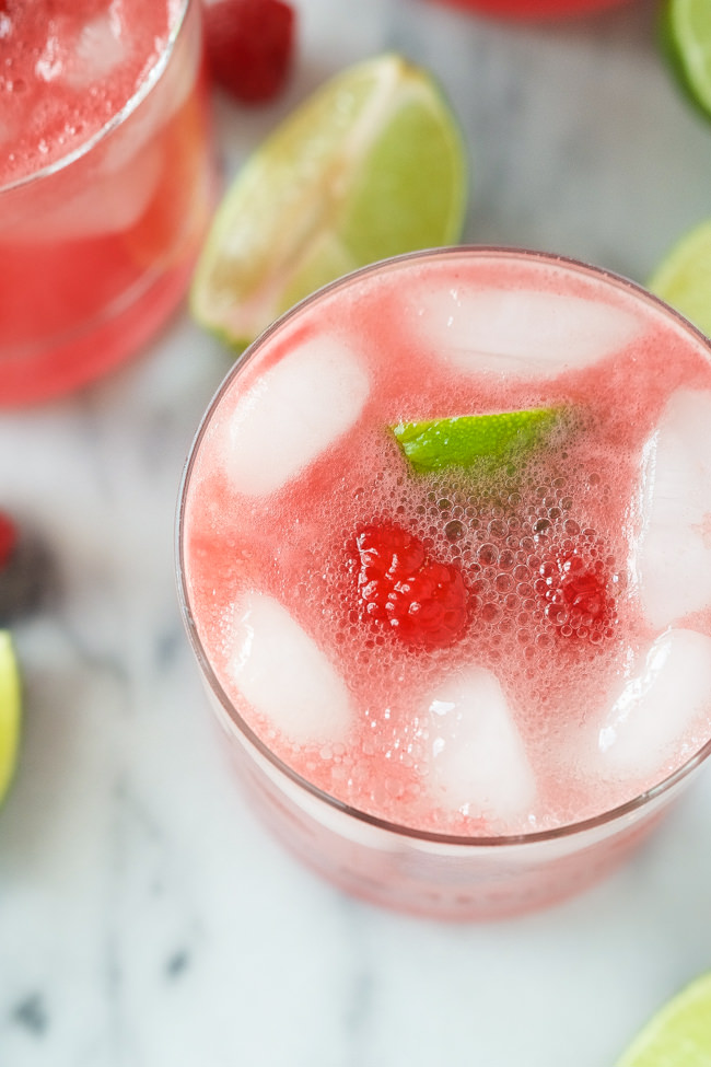 Raspberry Watermelon Margaritas are fruity and lighter thanks to fresh watermelon puree, a skinny simple syrup and the sparkling water topper! Perfect drink to kick your feet up with!